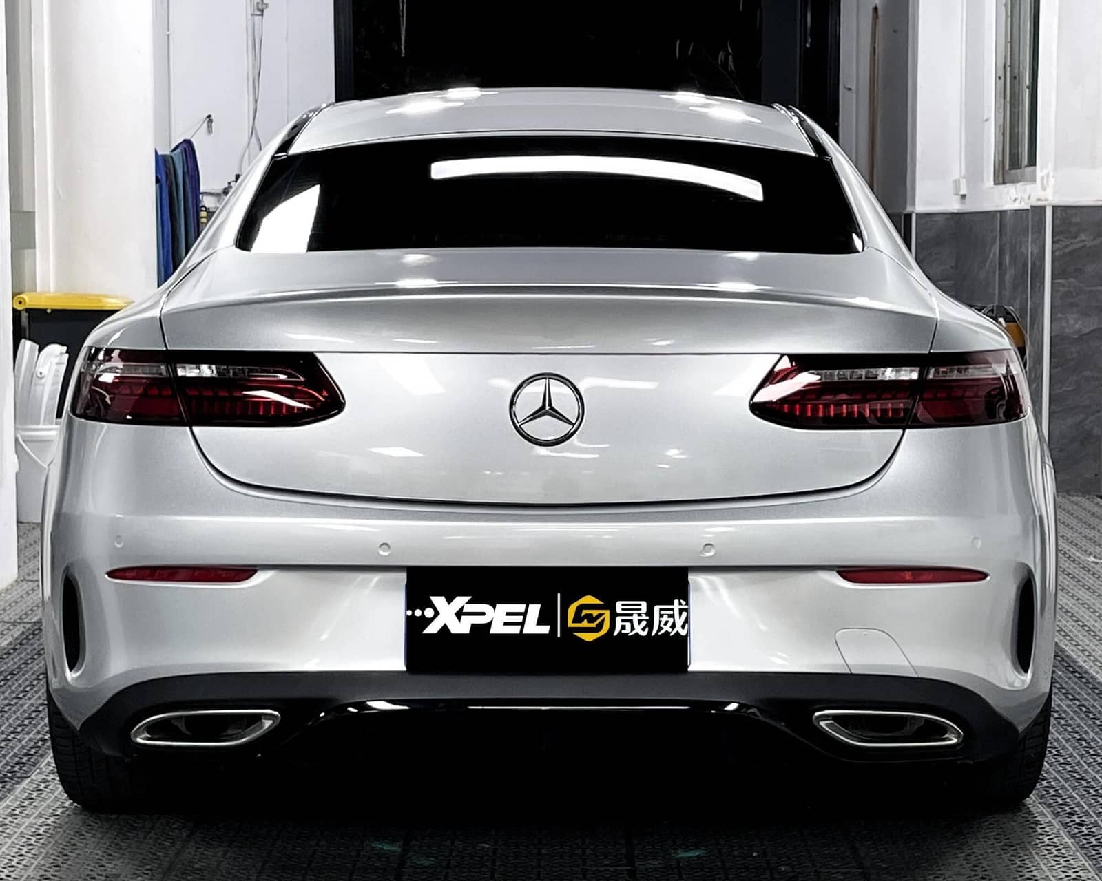 Silver Mercedes car shown from rear in garage without Pre-cut Tesla Vinyl Wrap Kit