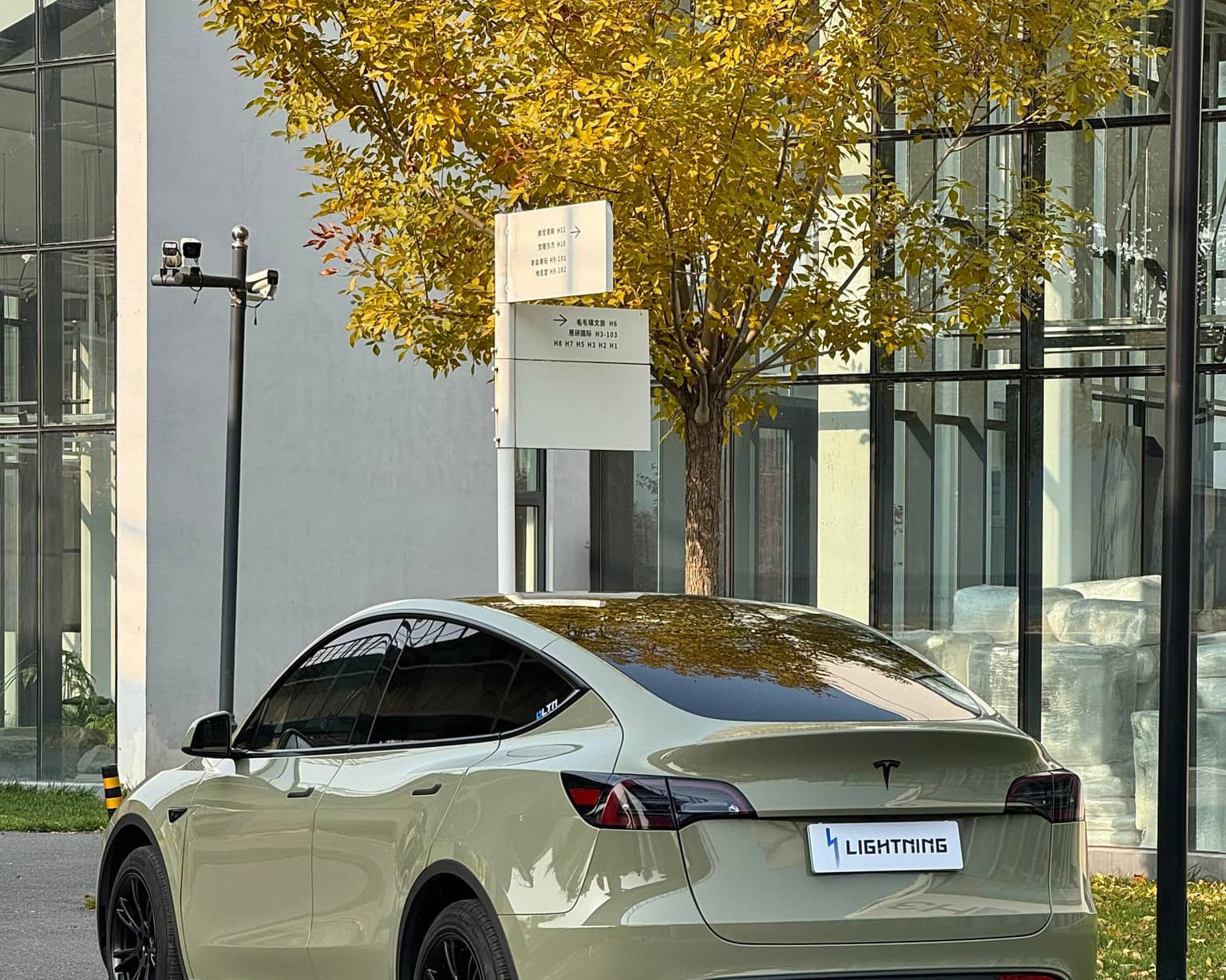 Tesla electric car wrapped in matte olive green using Pre-cut Tesla Vinyl Wrap Kit by WrapBug
