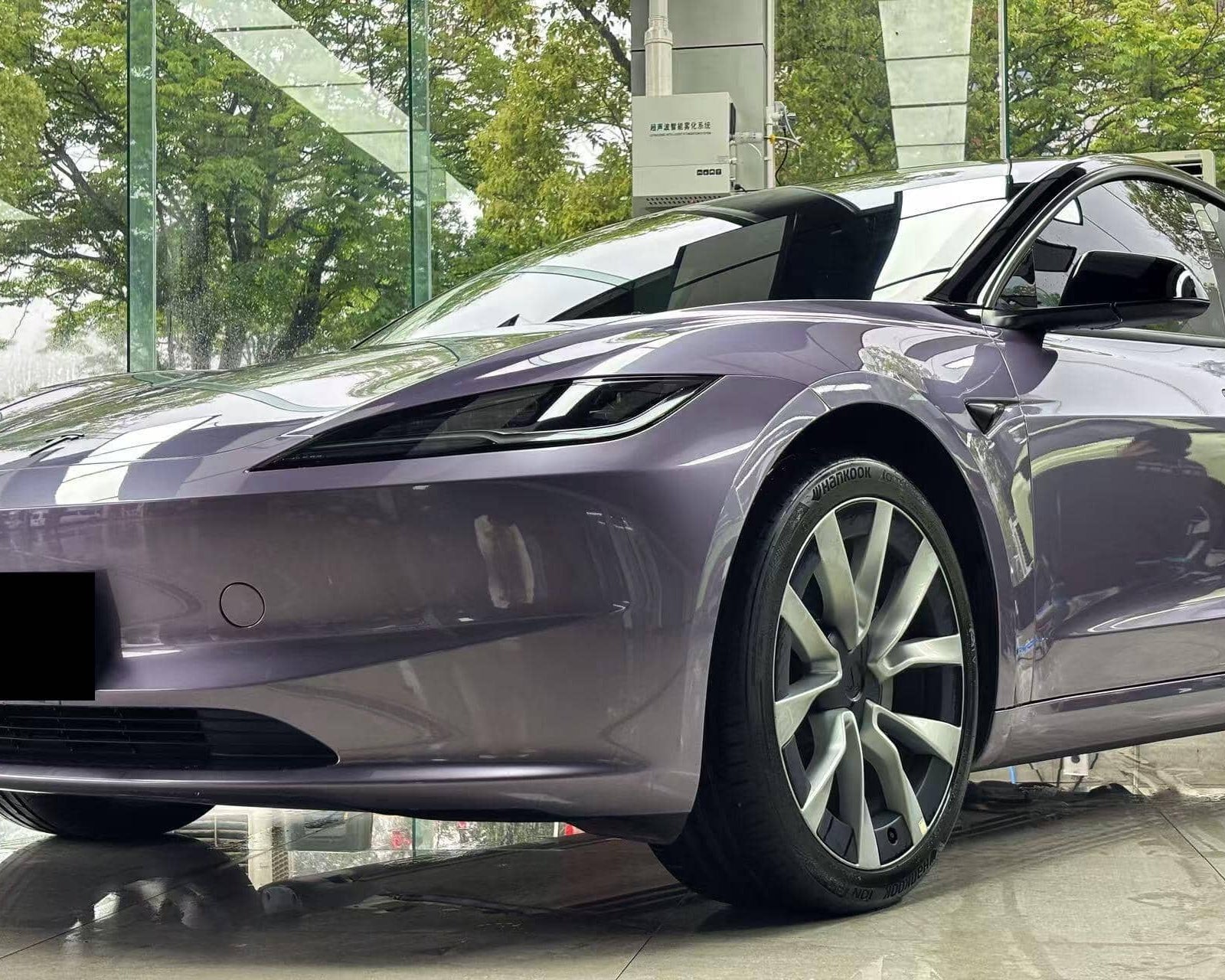 Purple Tesla Model 3 featuring a glossy finish using WrapBug Pre-cut Tesla Wrap Kit for sleek design