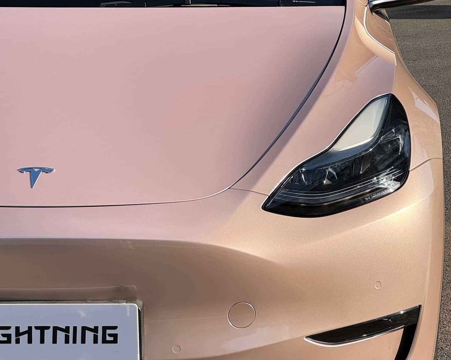 Tesla car front wrapped with pink finish using Pre-cut Tesla Wrap Kit by WrapBug