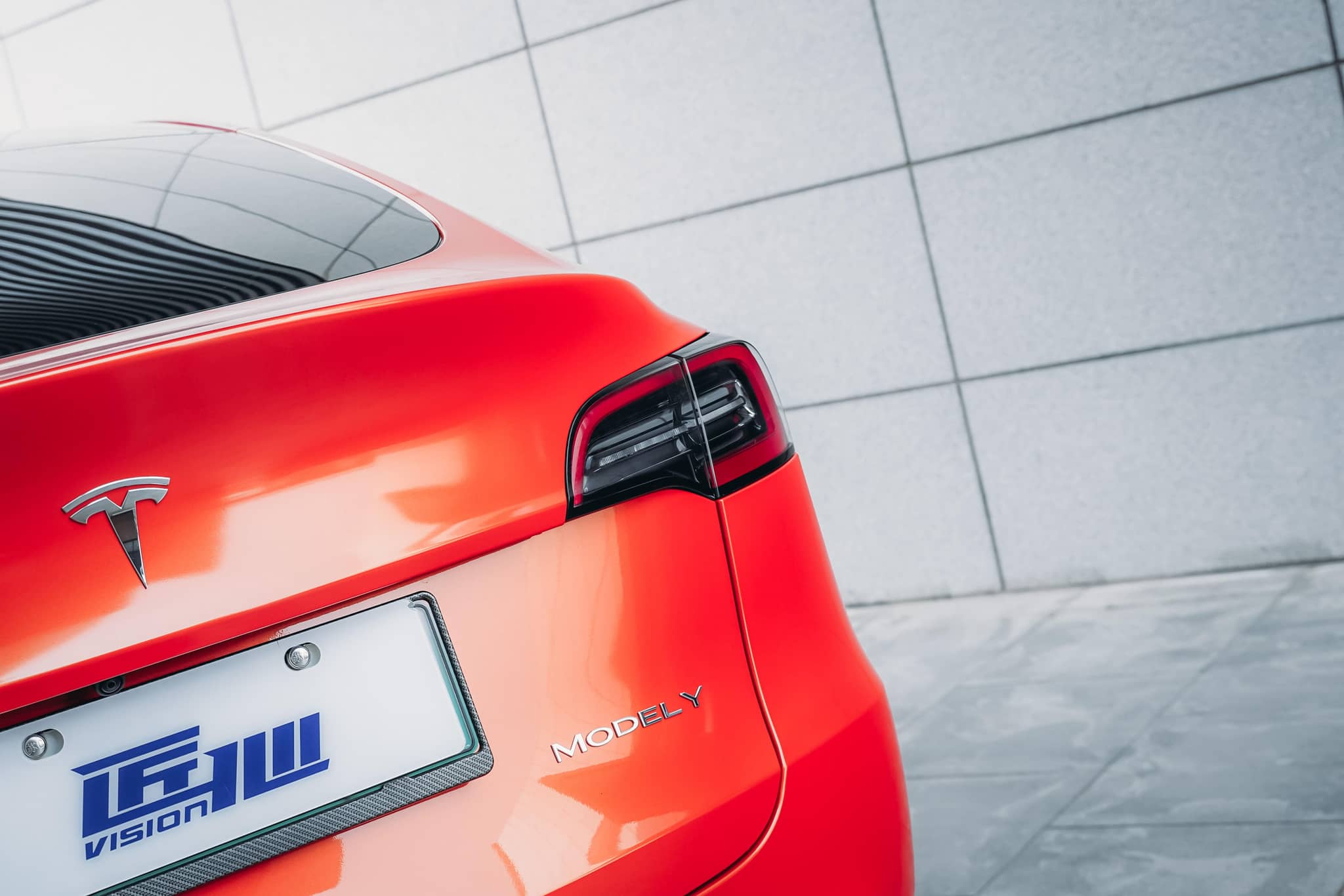 WrapBug Pre-cut Tesla Wrap Kit applied on rear of red Tesla Model Y with glossy finish