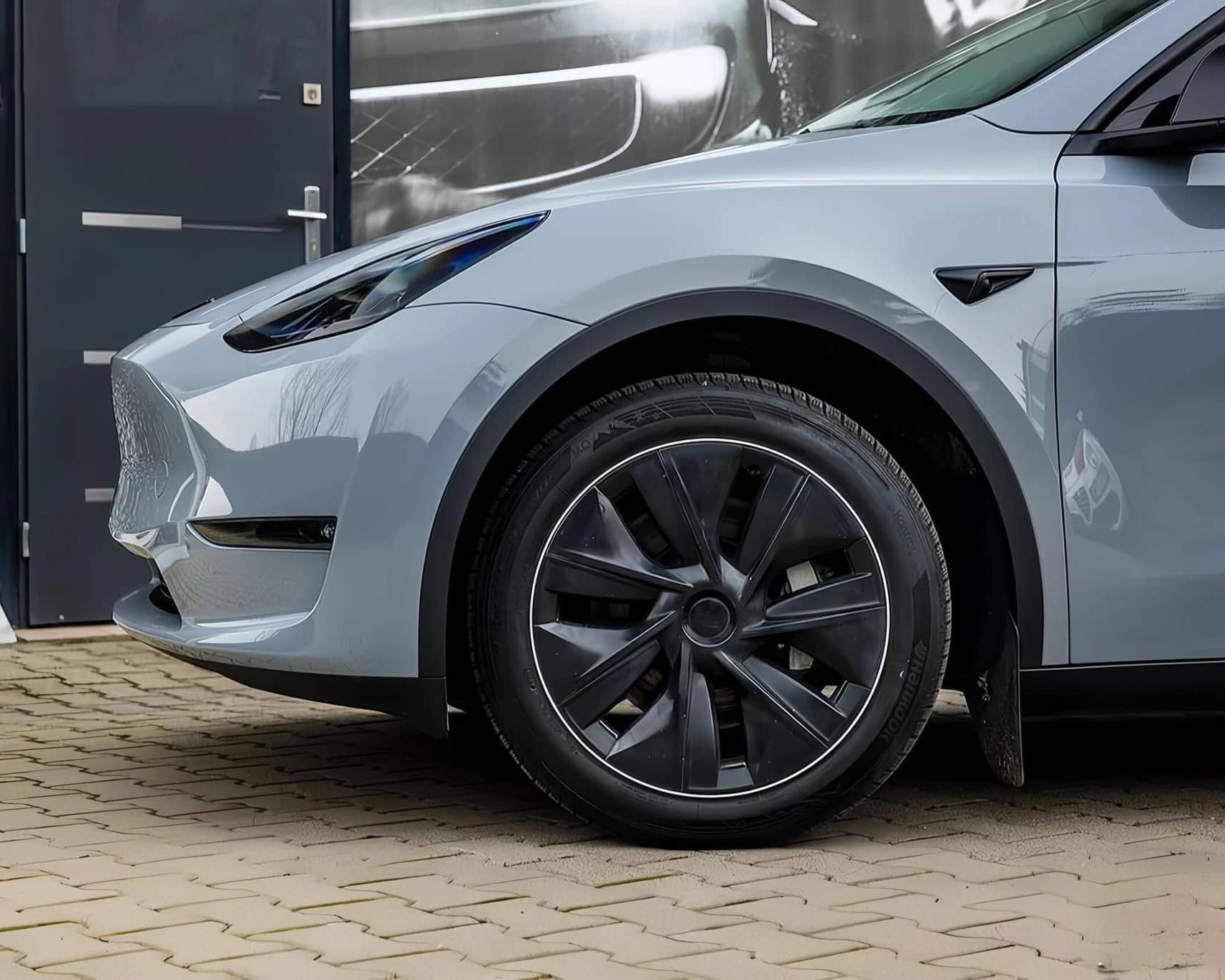 WrapBug protective car wrap on front side of gray electric vehicle showcasing smooth matte finish