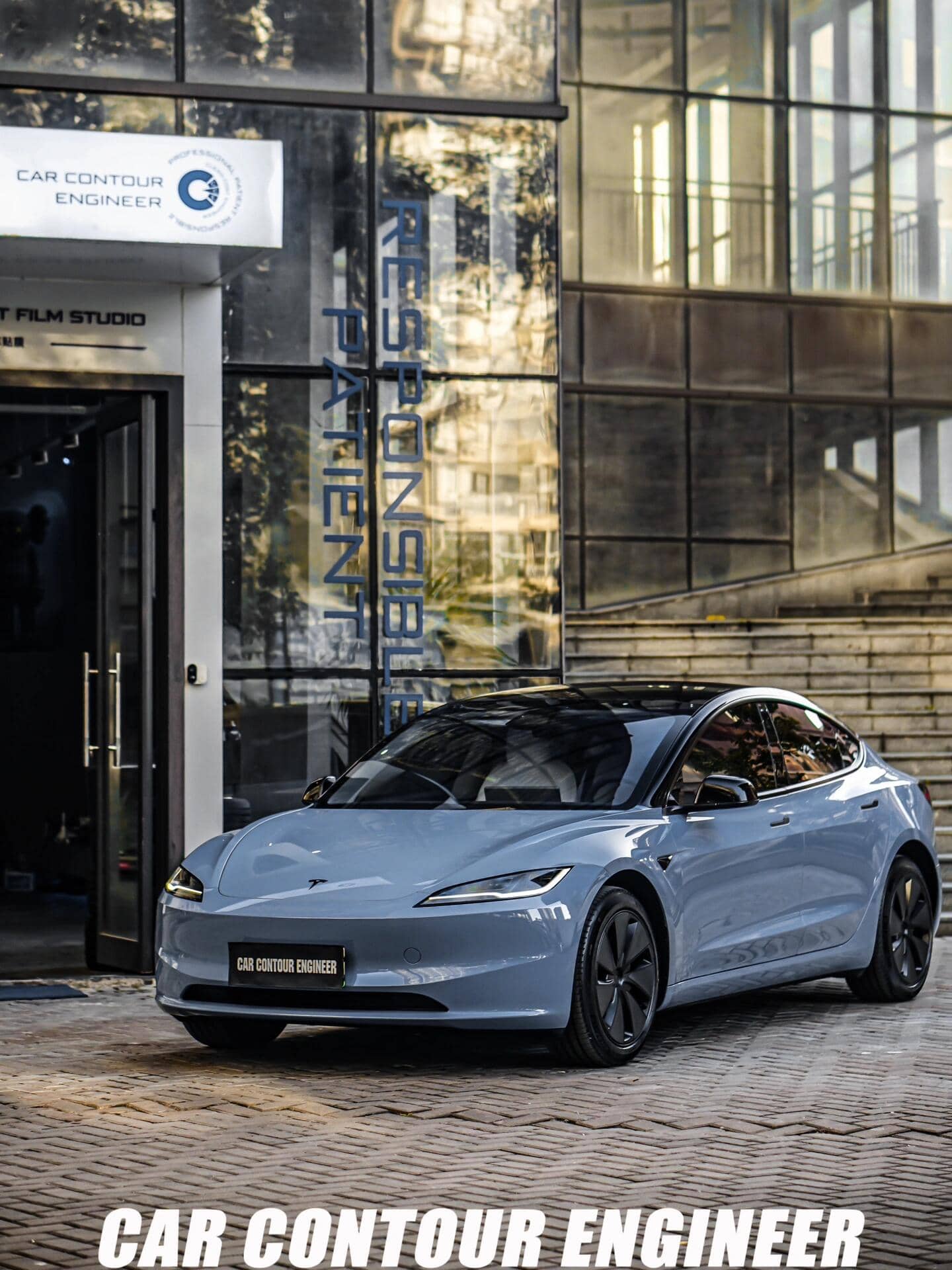 Blue Tesla Model Y parked outside Car Contour Engineer studio using Pre-cut Tesla Vinyl Wrap Kit