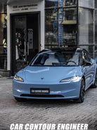 Pre-cut Tesla Vinyl Wrap Kit applied on a sleek blue Tesla parked on a city street by WrapBug