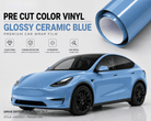 Pre-cut Tesla Vinyl Wrap Kit in glossy ceramic blue showing roll of vinyl and wrapped blue Tesla car