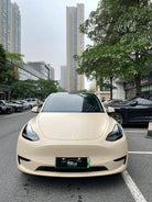 Front view of Tesla car with matte MATTE SPACE GRAY tesla wrap parked on city street