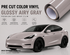 Pre-cut Tesla Vinyl Wrap in glossy airy gray showing premium car wrap film on a Tesla Model Y