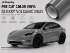 Pre-cut Tesla Vinyl Wrap Kit in glossy volcanic gray displayed on a Tesla Model Y with a premium car wrap film roll
