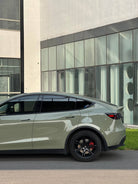 Taupe Tesla Model Y with black wheels featuring WrapBug Pre-cut Tesla Vinyl Wrap Kit exterior