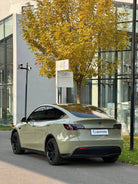 Tesla electric car wrapped in matte olive green using Pre-cut Tesla Vinyl Wrap Kit by WrapBug