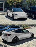 White Tesla Model 3 parked outdoors showcasing smooth finish with Pre-cut Tesla Vinyl Wrap by WrapBug