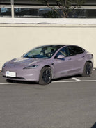Tesla Model 3 in light purple color featuring WrapBug Pre-cut Tesla Wrap Kit parked outdoors