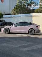 Tesla Model 3 parked with light purple wrap applied using Pre-cut Tesla Wrap Kit by WrapBug