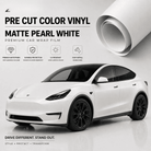 Pre-cut Tesla wrap kit in matte pearl white vinyl showing a wrapped Tesla Model Y with premium car wrap film