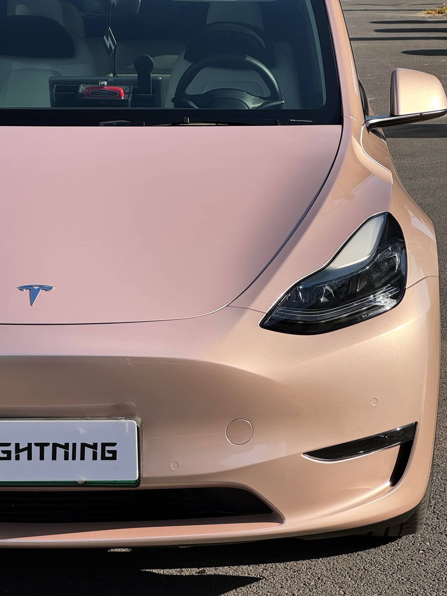 Tesla car front wrapped with pink finish using Pre-cut Tesla Wrap Kit by WrapBug