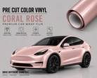 Pre-cut Tesla Wrap Kit in Coral Rose color vinyl showing a pink Tesla SUV with glossy, durable, and UV resistant car wrap film