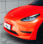 Red Tesla Model 3 front end wrapped with a Pre-cut Tesla Wrap Kit by WrapBug in a glossy finish