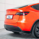 Orange Tesla Model Y with sleek finish using Pre-cut Tesla Wrap Kit by WrapBug