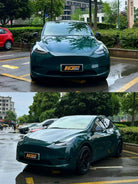 WrapBug Pre-cut Tesla Vinyl Wrap Kit on a dark green Tesla Model Y parked outdoors on a rainy day