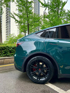 Tesla Model Y rear side wrapped with WrapBug Pre-cut Tesla Vinyl Wrap Kit in glossy green finish