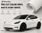 Pre-cut Tesla Vinyl Wrap Kit in matte ivory white showing a wrapped Tesla Model Y with black wheels