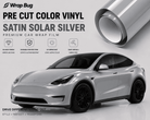 Pre-cut Tesla Vinyl Wrap Kit in satin solar silver applied on white Tesla model with glossy finish