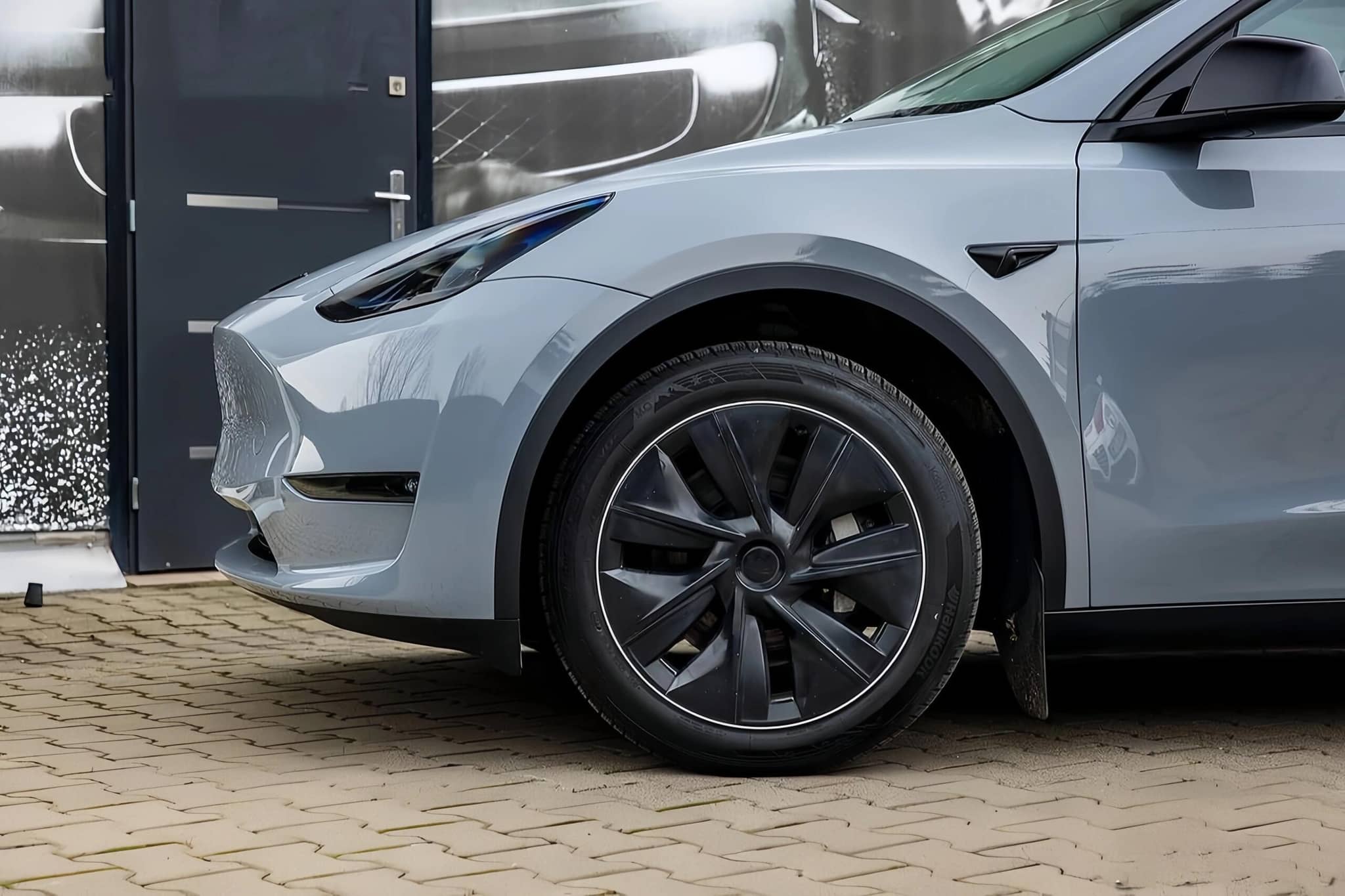 WrapBug protective car wrap on front side of gray electric vehicle showcasing smooth matte finish