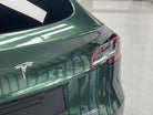 WrapBug pre-cut Tesla wrap kit applied to rear of green Tesla Model Y for smooth finish