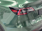 WrapBug Pre-cut Tesla Wrap Kit applied on green Tesla rear tail light and body panel